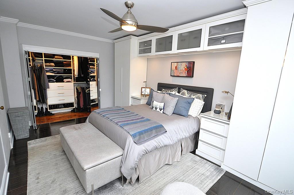 281 Garth Road, Unit A5L Scarsdale, NY 10583 - Photo 24 of 46 a bedroom with a bed and a refrigerator