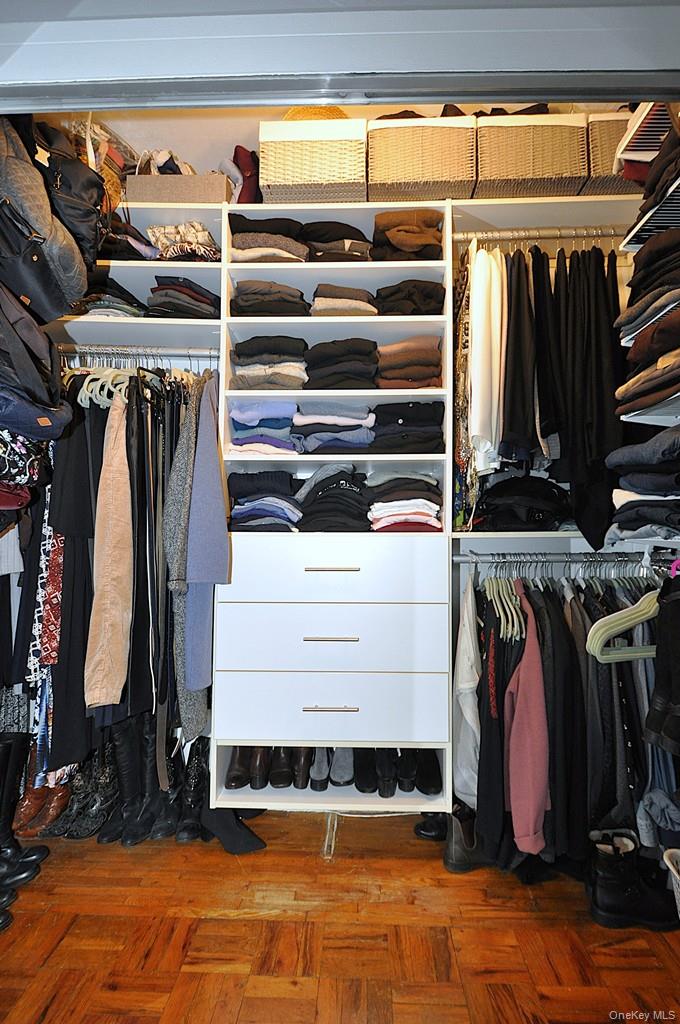 281 Garth Road, Unit A5L Scarsdale, NY 10583 - Photo 27 of 46 a view of walk in closet with clothes and shoes