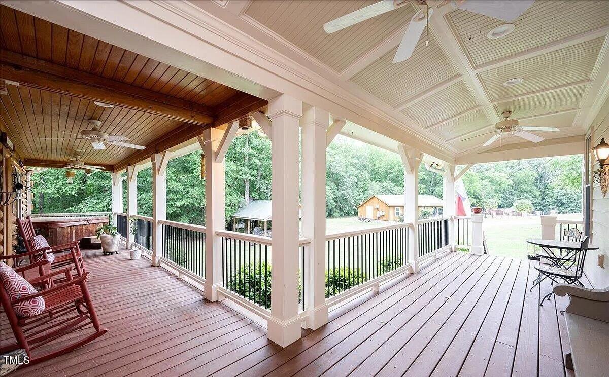 413 Johnson Town Road Zebulon, NC 27597 - Photo 13 of 52 a view of a patio with wooden floor