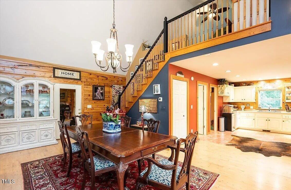 413 Johnson Town Road Zebulon, NC 27597 - Photo 20 of 52 a view of a dining room with furniture window and wooden floor