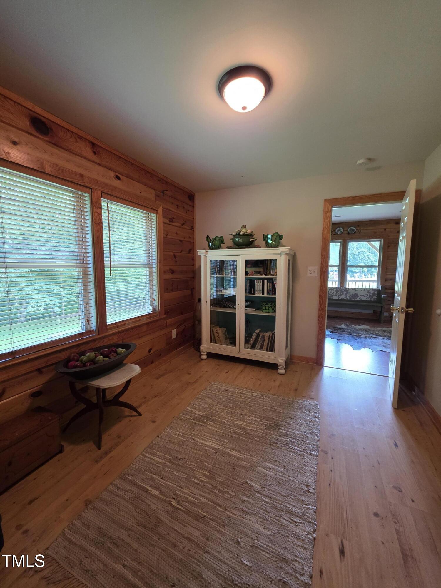 413 Johnson Town Road Zebulon, NC 27597 - Photo 28 of 52 wooden floor in an empty room with a window