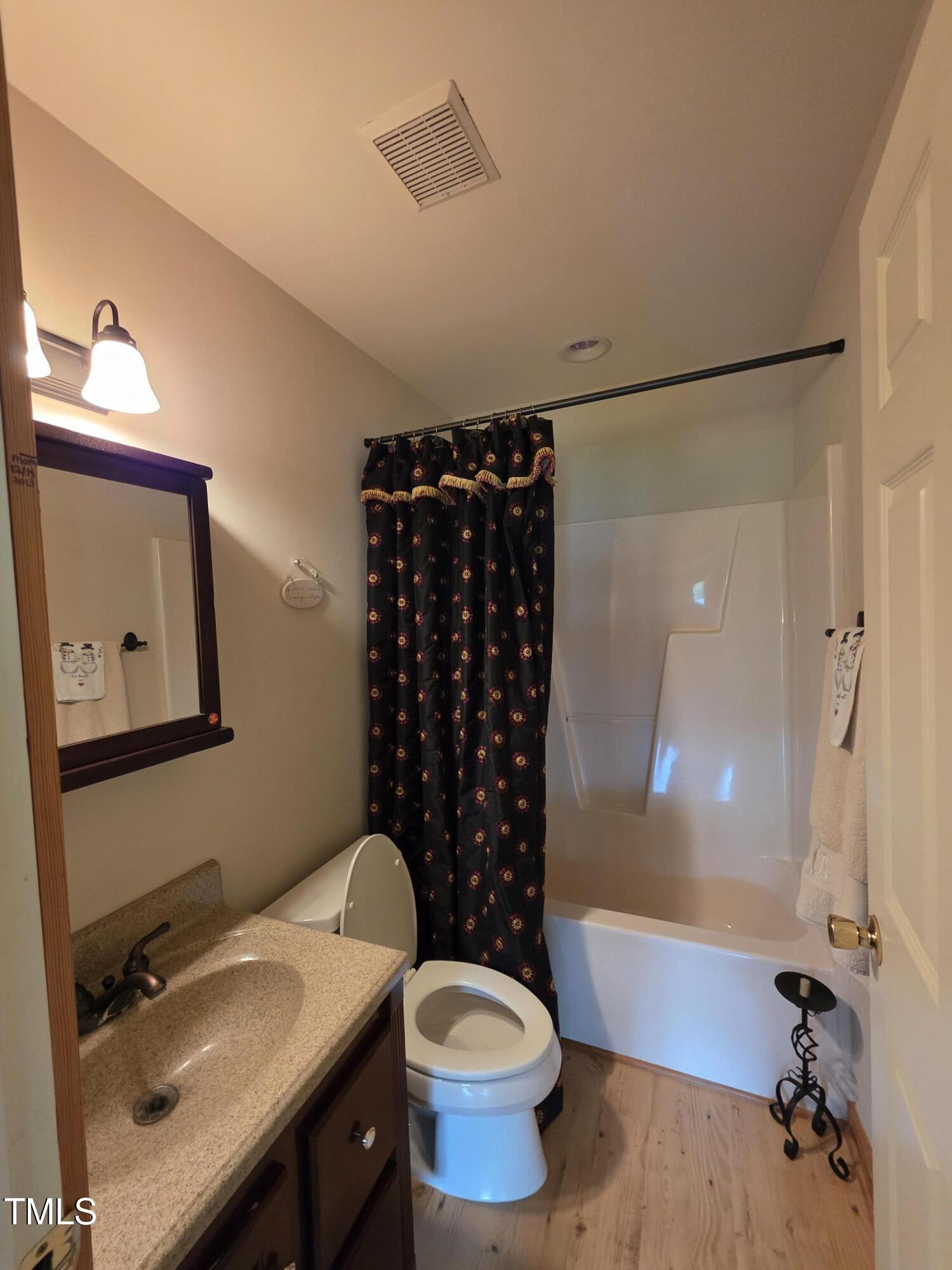 413 Johnson Town Road Zebulon, NC 27597 - Photo 29 of 52 a bathroom with a sink toilet and shower