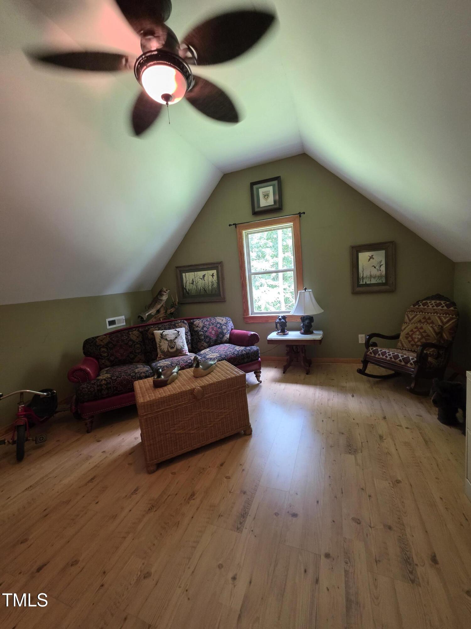 413 Johnson Town Road Zebulon, NC 27597 - Photo 35 of 52 a living room with furniture and a large window