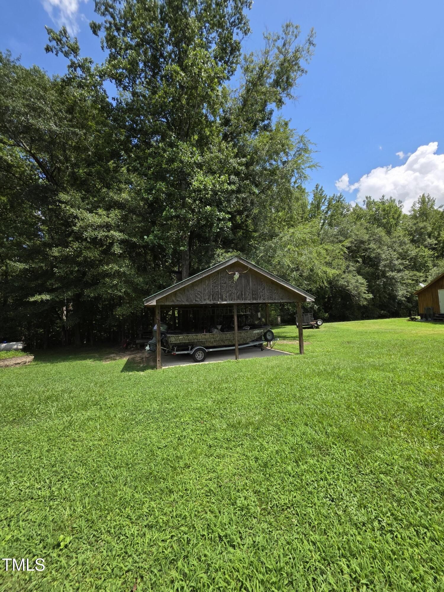 413 Johnson Town Road Zebulon, NC 27597 - Photo 40 of 52 a view of a garden with a slide