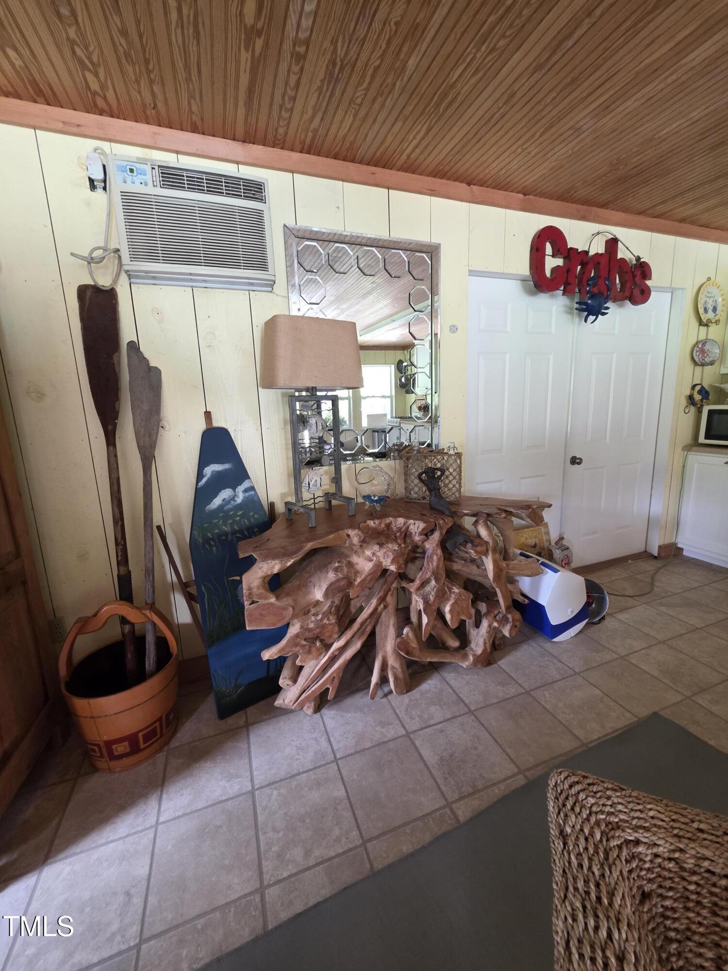 413 Johnson Town Road Zebulon, NC 27597 - Photo 43 of 52 a room with lots of furniture and a rug