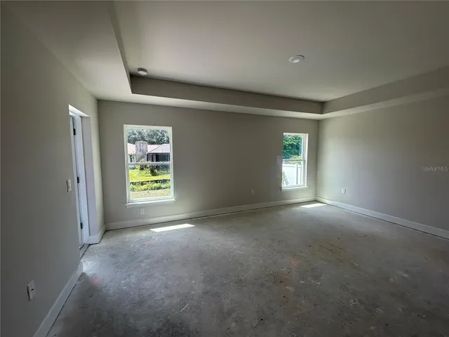 an empty room with windows