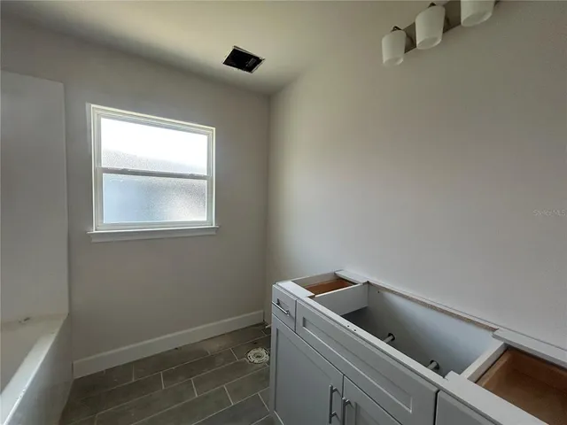 a view of storage and utility room with washer and dryer