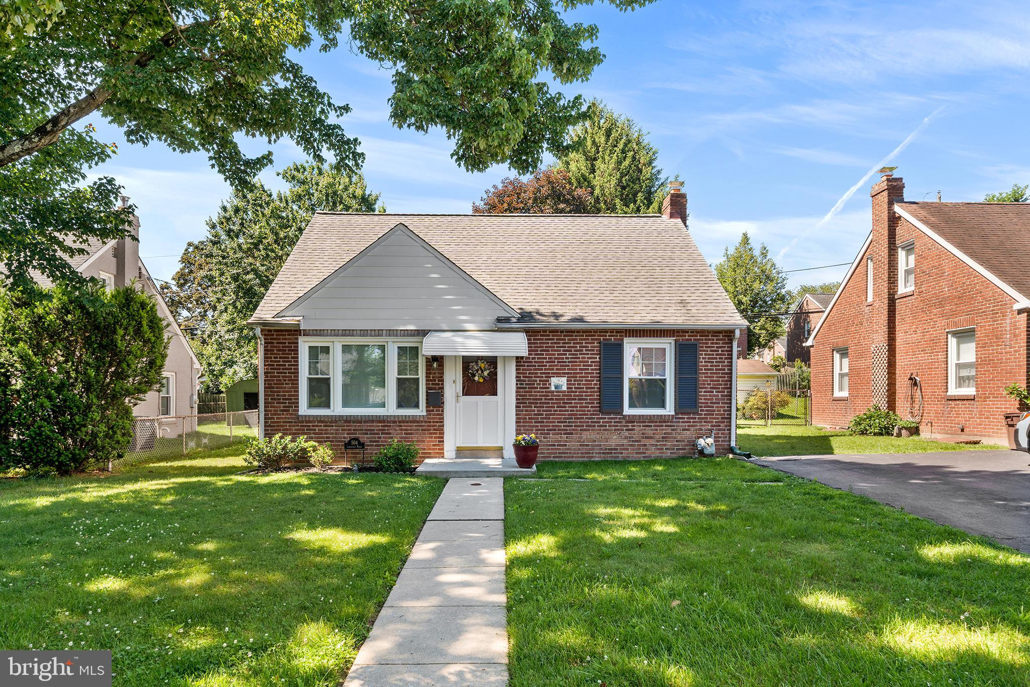 504 Lawrence Road Havertown, PA 19083 - Photo 1 of 20 a front view of house with yard and green space