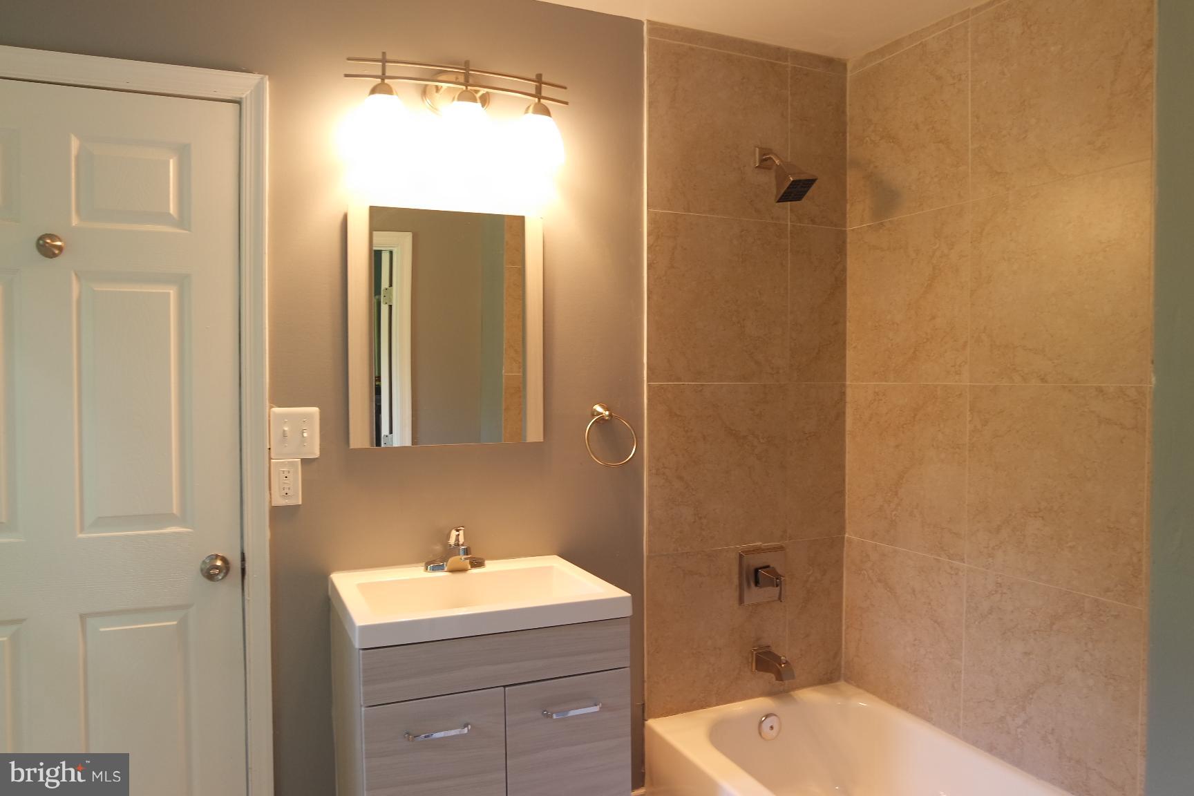 421 Bryan Point Road Accokeek, MD 20607 - Photo 8 of 17 a bathroom with a sink and a mirror