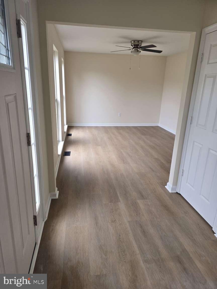 10 Osprey Lane Middletown, DE 19709 - Photo 14 of 25 wooden floor in a hallway