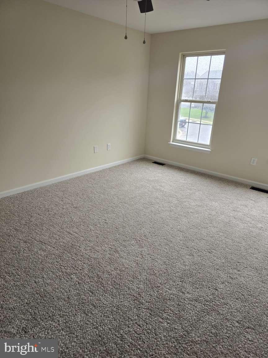 10 Osprey Lane Middletown, DE 19709 - Photo 18 of 25 an empty room with windows