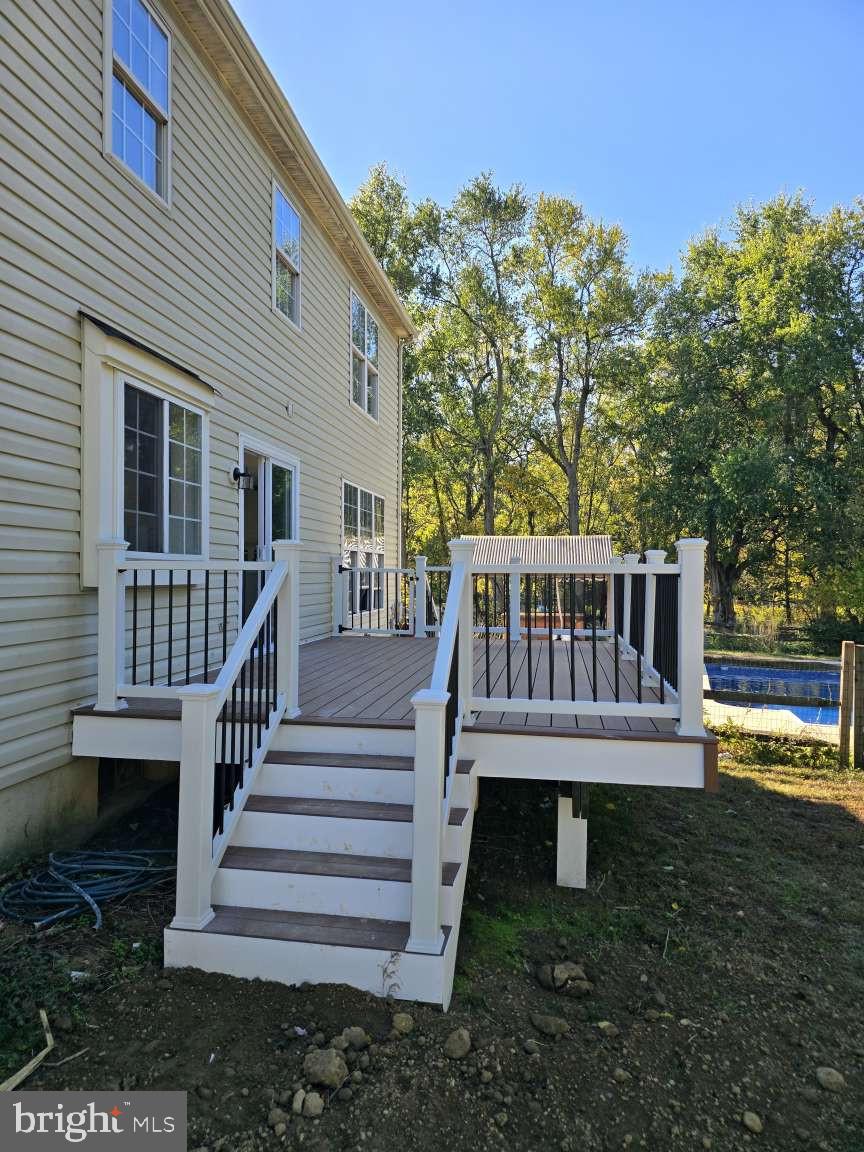 10 Osprey Lane Middletown, DE 19709 - Photo 21 of 25 a view of a house with a deck and a yard
