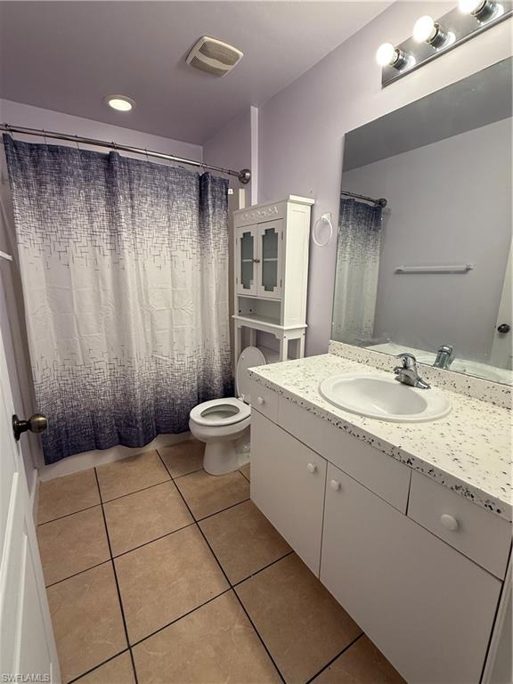 3122 12th Street Southwest Lehigh Acres, FL 33976 - Photo 17 of 19 a bathroom with a granite countertop sink and a mirror