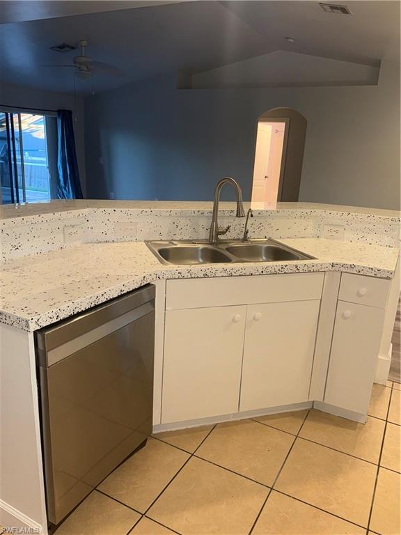 3122 12th Street Southwest Lehigh Acres, FL 33976 - Photo 6 of 19 a kitchen with granite countertop a sink and a stove top oven