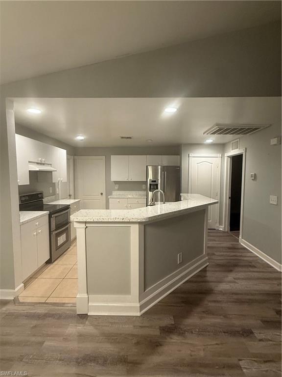3122 12th Street Southwest Lehigh Acres, FL 33976 - Photo 7 of 19 a kitchen with a sink and cabinets