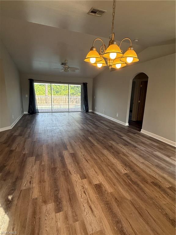 3122 12th Street Southwest Lehigh Acres, FL 33976 - Photo 8 of 19 a view of a room with wooden floor and chandelier