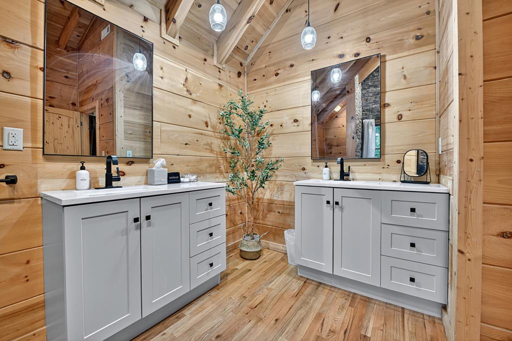 1134 Maggie Chapman Road Blue Ridge, GA 30513 - Photo 11 of 65 a spacious bathroom with double vanity and a mirror