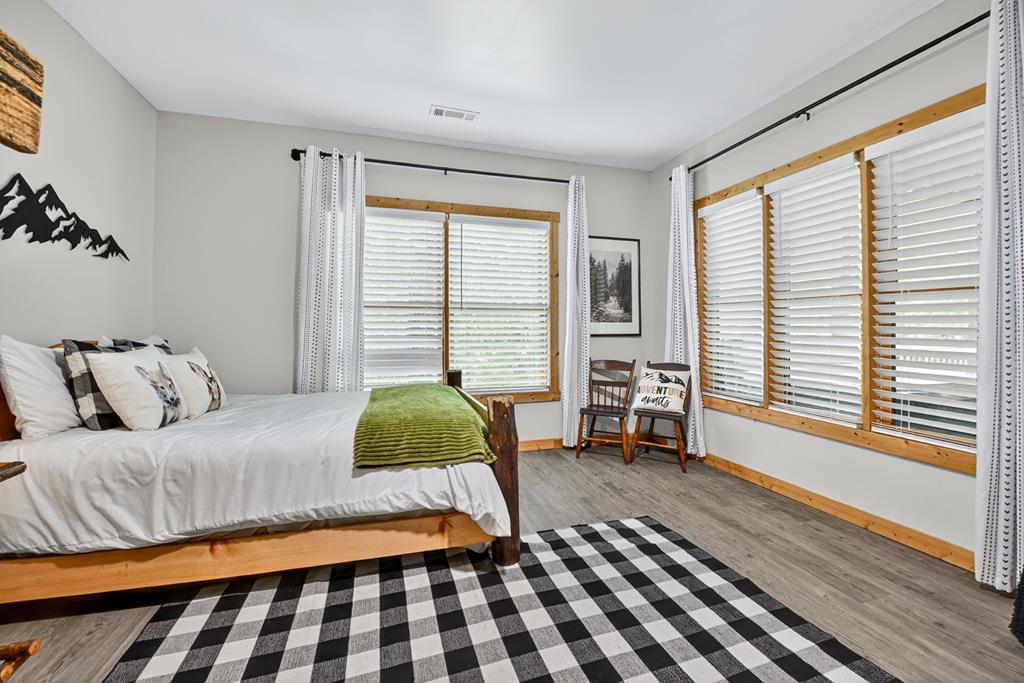 1134 Maggie Chapman Road Blue Ridge, GA 30513 - Photo 13 of 65 a bedroom with a bed and a window