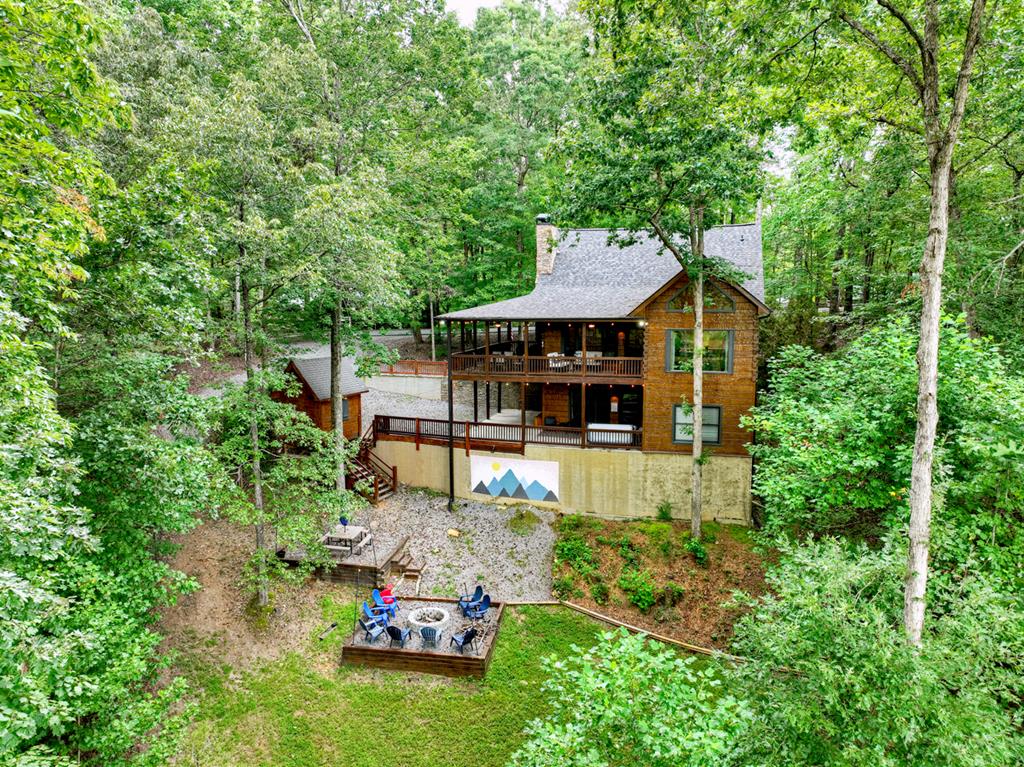 1134 Maggie Chapman Road Blue Ridge, GA 30513 - Photo 19 of 65 an aerial view of a house with swimming pool and big yard