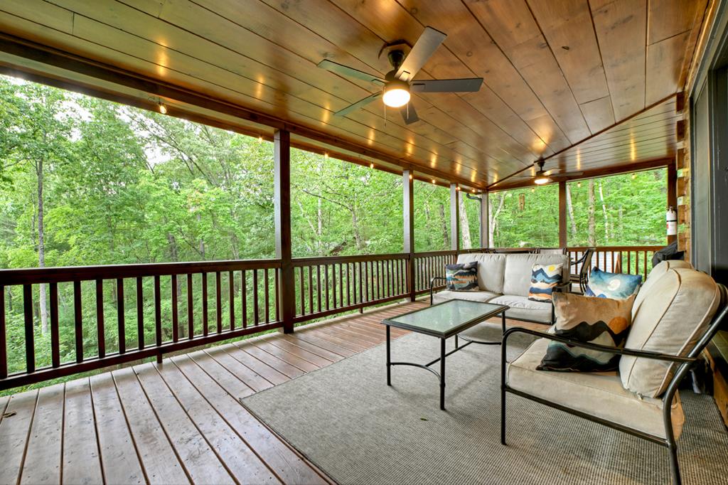 1134 Maggie Chapman Road Blue Ridge, GA 30513 - Photo 33 of 65 a view of a chairs and table in the balcony