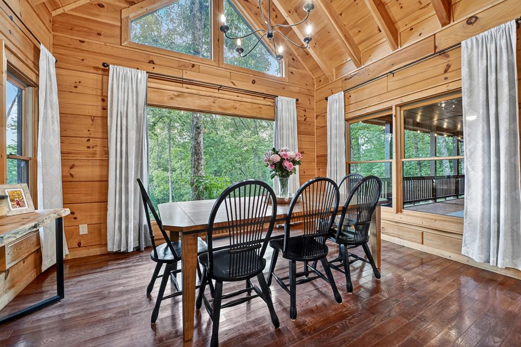 1134 Maggie Chapman Road Blue Ridge, GA 30513 - Photo 39 of 65 a view of a dining room with furniture window and wooden floor