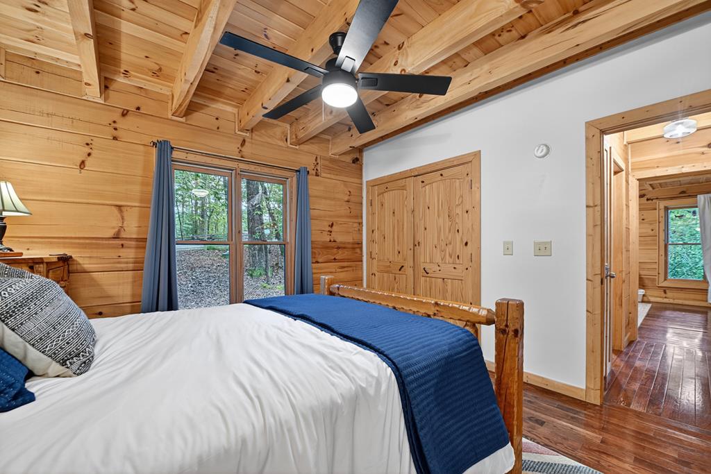 1134 Maggie Chapman Road Blue Ridge, GA 30513 - Photo 47 of 65 a bedroom with a large bed and a large window