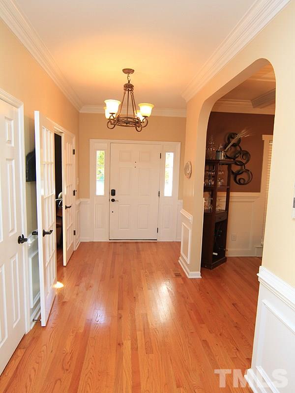 9908 Wyngate Ridge Drive Raleigh, NC 27617 - Photo 2 of 20 Updated lighting, oil-rubbed bronze door knobs and beautiful hardwood floors greet you in this welcoming entry foyer.
