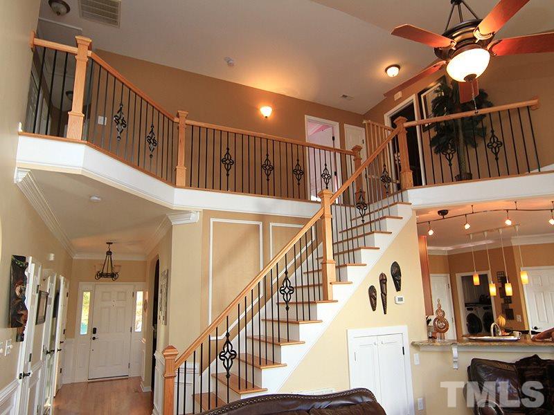 9908 Wyngate Ridge Drive Raleigh, NC 27617 - Photo 11 of 20 All hardwood treads and updated spindles...looks like new construction!