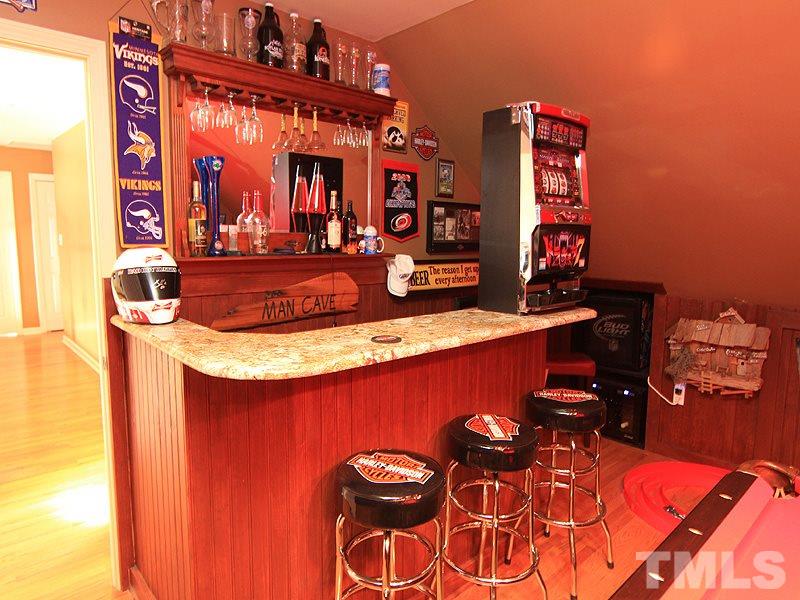9908 Wyngate Ridge Drive Raleigh, NC 27617 - Photo 13 of 20 Fun bonus space with granite bar makes the perfect man-cave!