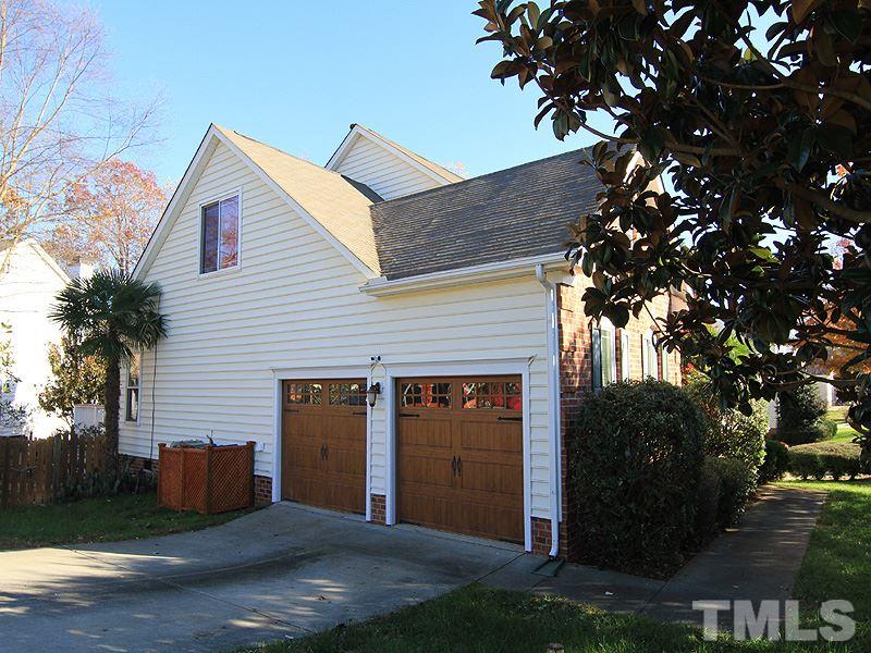 9908 Wyngate Ridge Drive Raleigh, NC 27617 - Photo 19 of 20 Custom Door and Gate garage doors with new electric openers including track, springs, etc. Nice side-load garage with a gladiator storage system that every man will love. Come see!