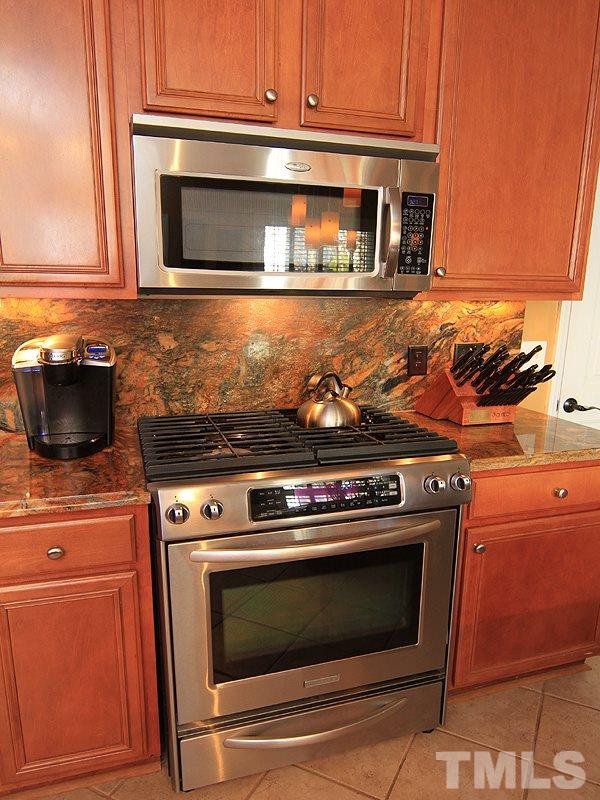 9908 Wyngate Ridge Drive Raleigh, NC 27617 - Photo 7 of 20 This gas stove features a convection oven and warming drawer.