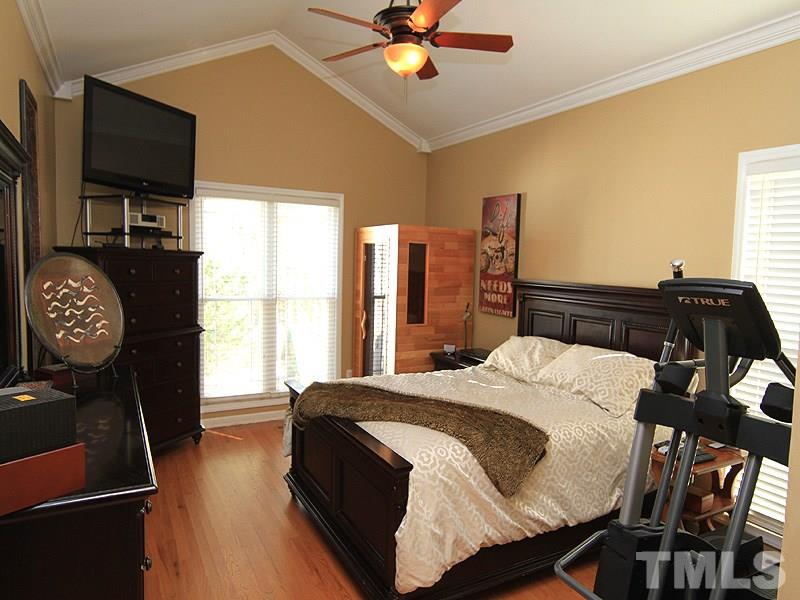 9908 Wyngate Ridge Drive Raleigh, NC 27617 - Photo 9 of 20 More hardwood floors located in this Master Suite with cathedral ceiling, updated fan and 2-inch blinds throughout.