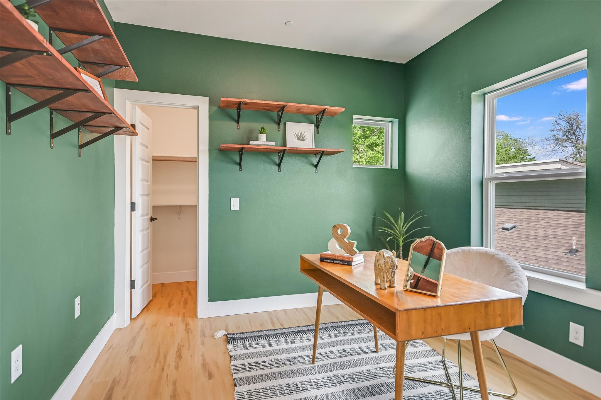 1121 Walton Lane, Unit B Austin, TX 78721 - Photo 13 of 18 a view of a dining room with a table and chairs