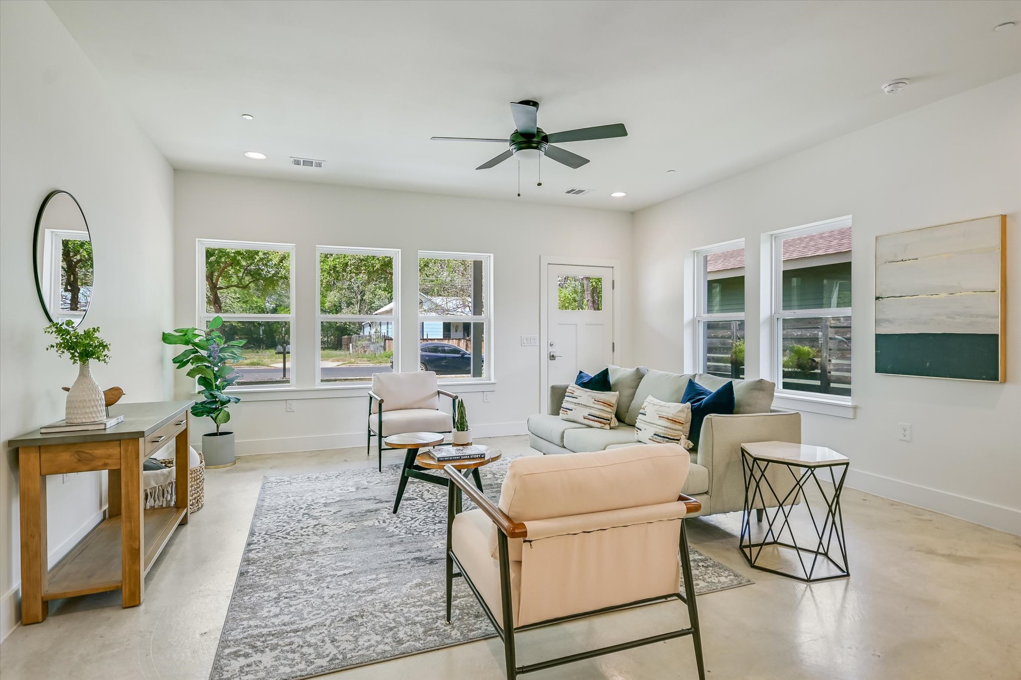 1121 Walton Lane, Unit B Austin, TX 78721 - Photo 3 of 18 a living room with furniture and a large window