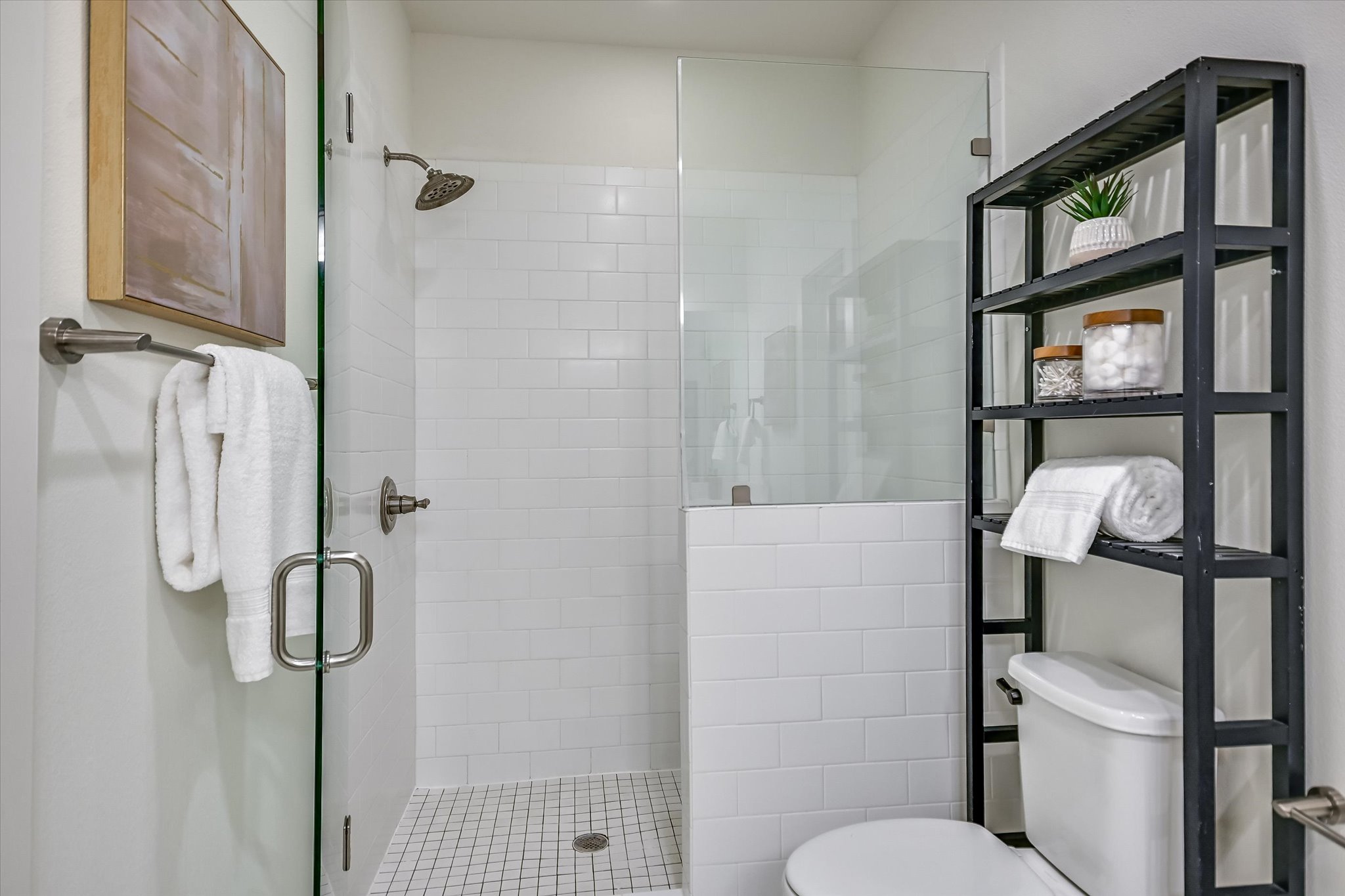1121 Walton Lane, Unit B Austin, TX 78721 - Photo 9 of 18 a bathroom with a toilet and a shower