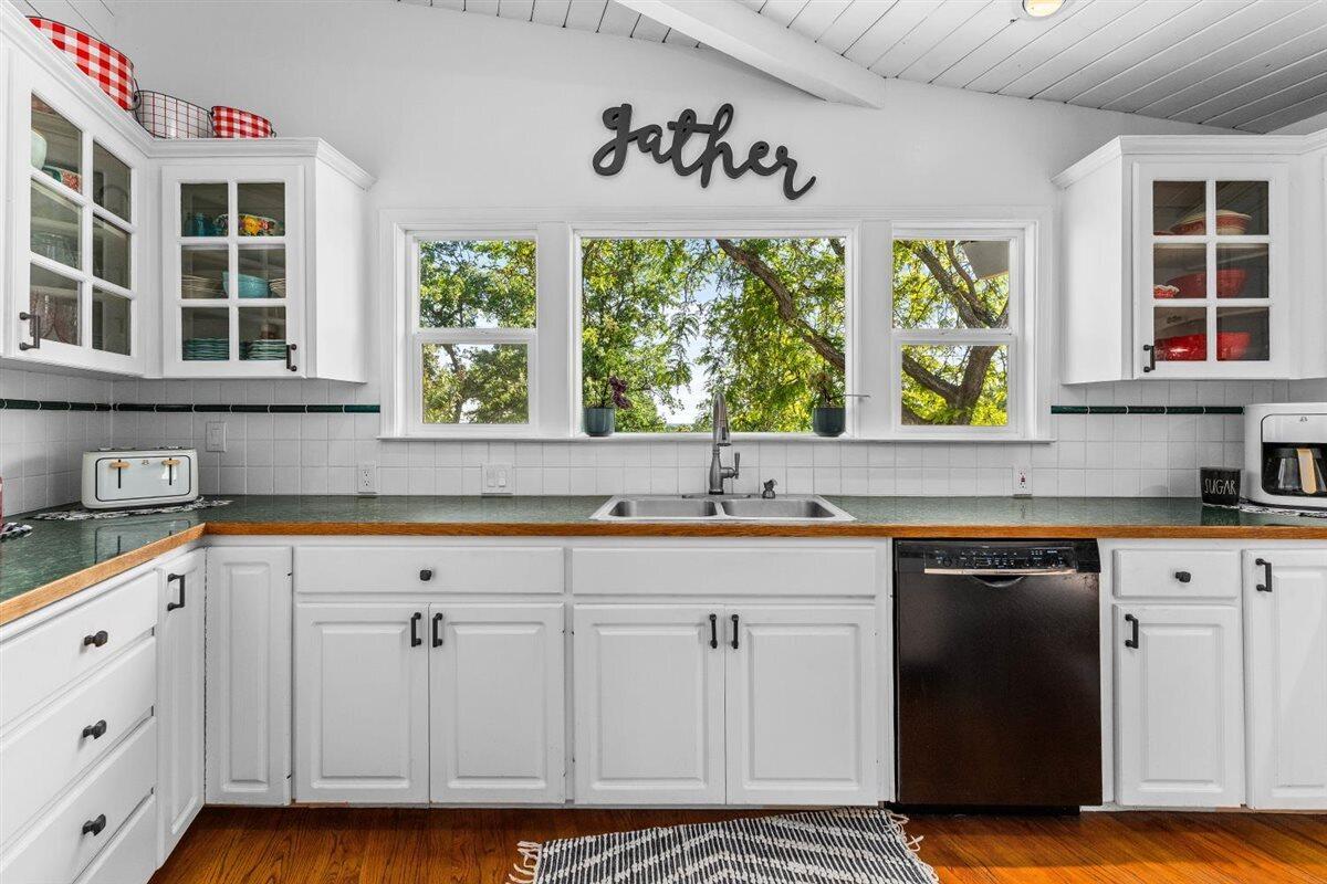 14545 Carriage Lane Red Bluff, CA 96080 - Photo 17 of 67 a kitchen with stainless steel appliances granite countertop a stove a sink and a white cabinets
