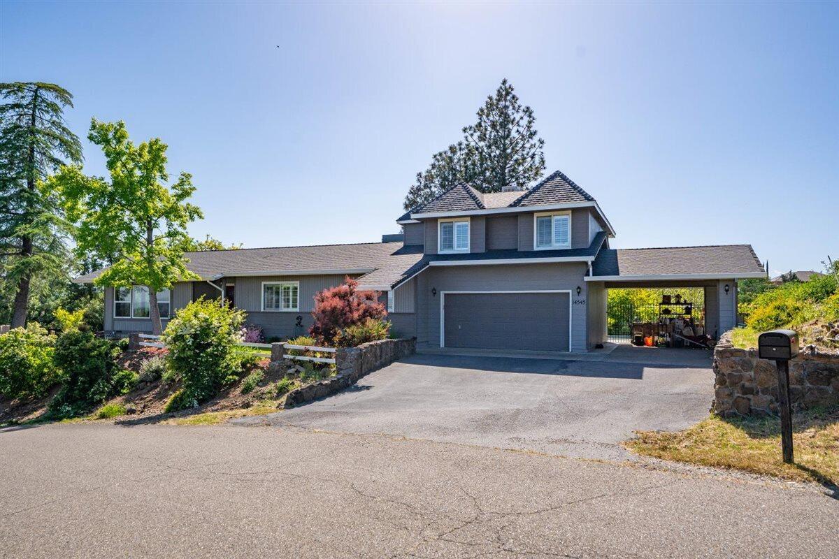 14545 Carriage Lane Red Bluff, CA 96080 - Photo 2 of 67 a view of a house with a yard and sitting area