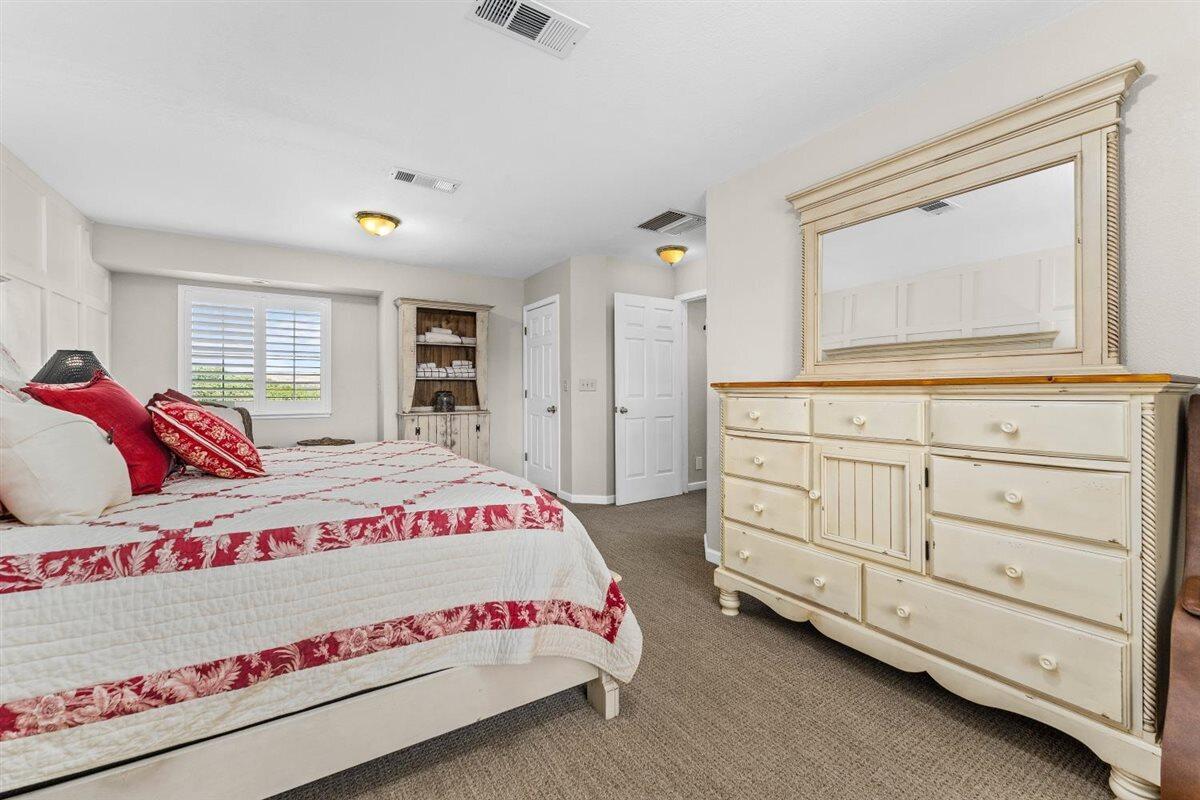 14545 Carriage Lane Red Bluff, CA 96080 - Photo 23 of 67 a bedroom with a bed and a dresser