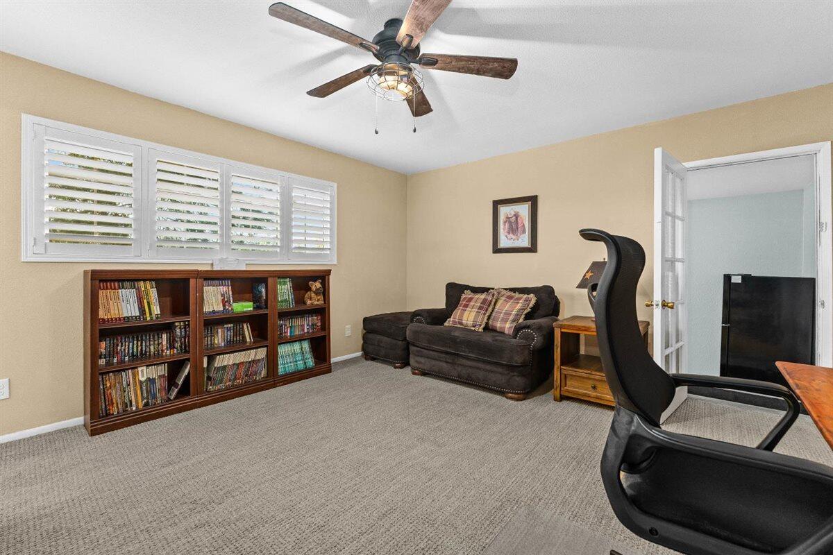14545 Carriage Lane Red Bluff, CA 96080 - Photo 28 of 67 a living room with furniture and a flat screen tv