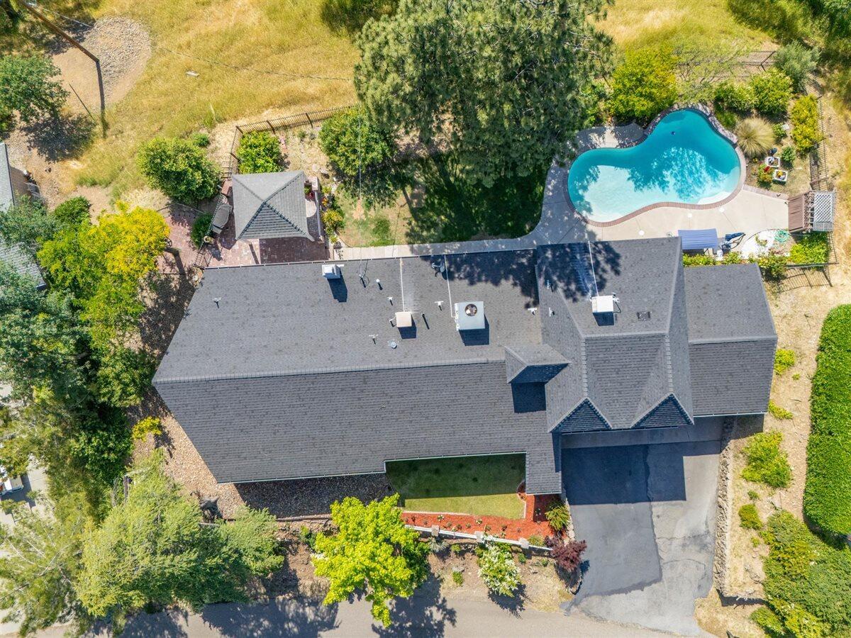 14545 Carriage Lane Red Bluff, CA 96080 - Photo 3 of 67 an aerial view of a house with a yard and a large tree