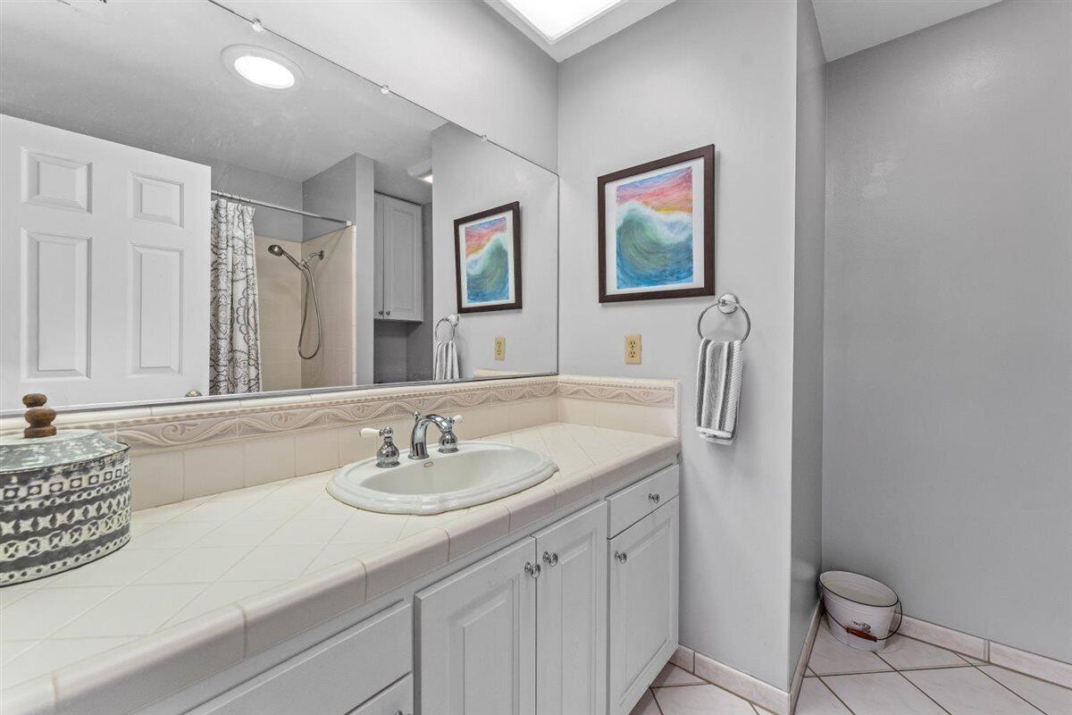 14545 Carriage Lane Red Bluff, CA 96080 - Photo 32 of 67 a bathroom with a sink a toilet and a mirror