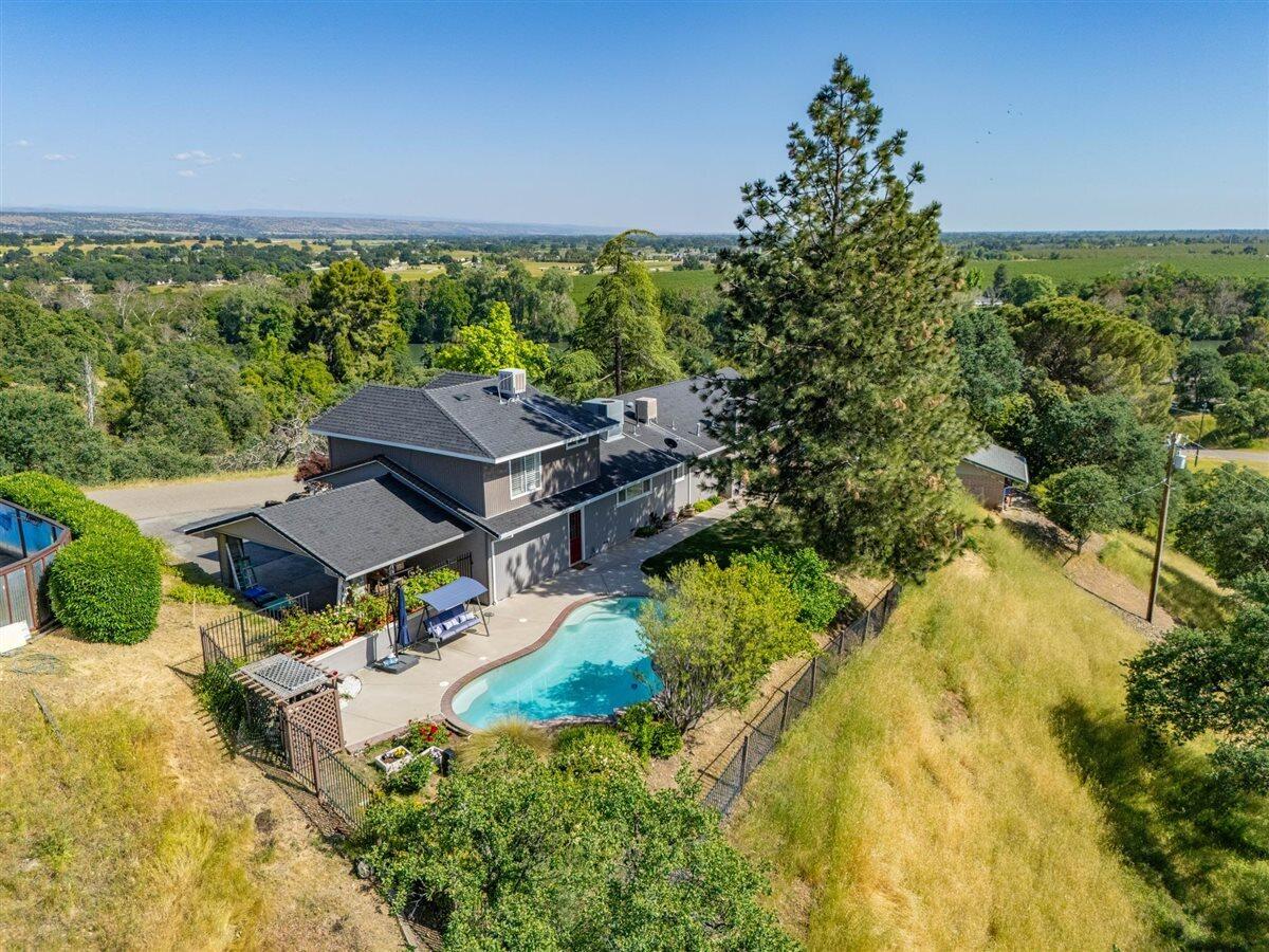 14545 Carriage Lane Red Bluff, CA 96080 - Photo 56 of 67 a view of a patio with table and chairs and potted plants