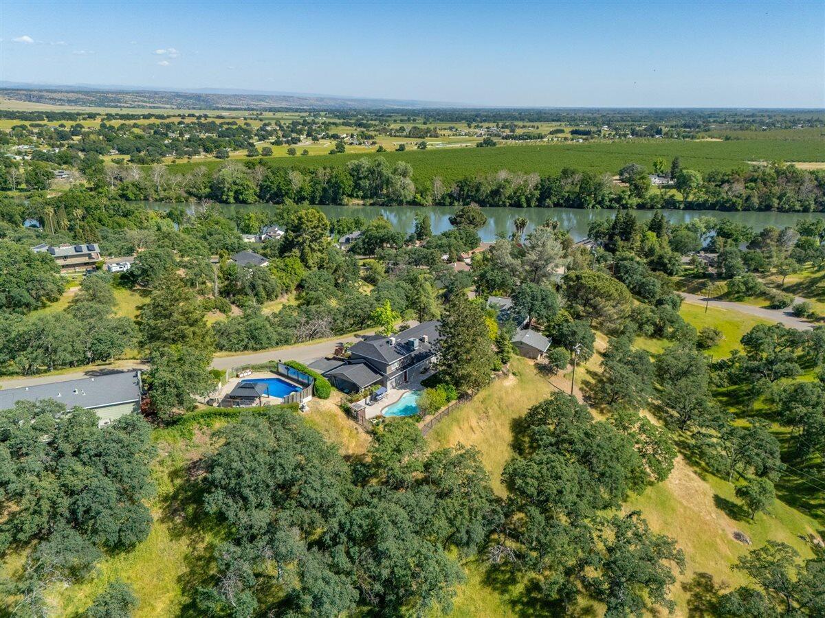14545 Carriage Lane Red Bluff, CA 96080 - Photo 61 of 67 an aerial view of residential houses with outdoor space and trees