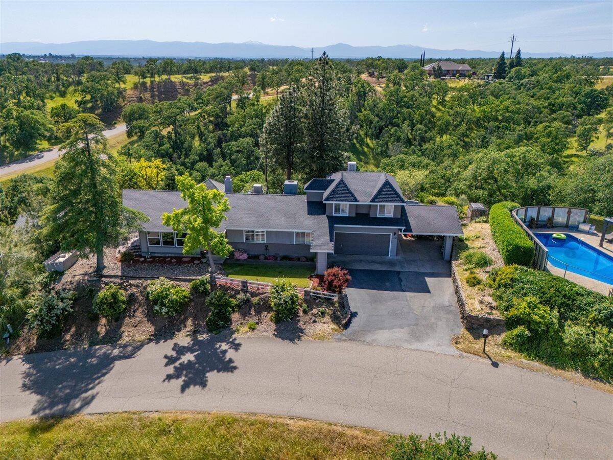 14545 Carriage Lane Red Bluff, CA 96080 - Photo 66 of 67 an aerial view of a house with a yard