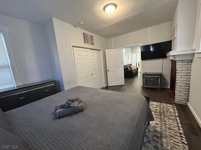 a bedroom with a bed and a dresser