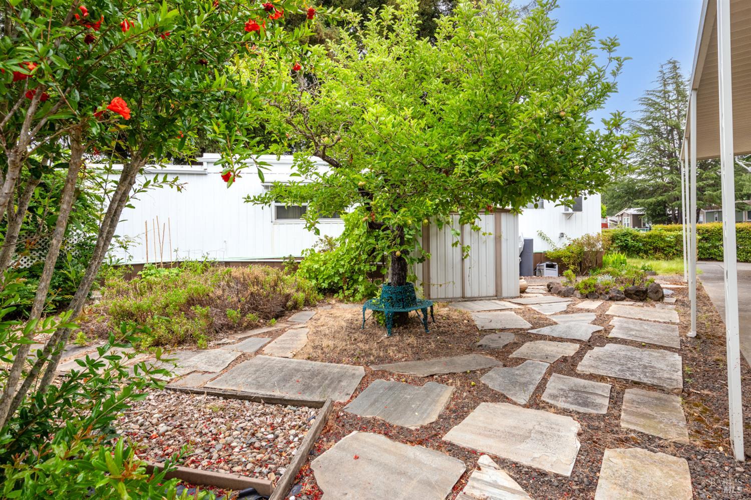 5754 Lois Avenue Santa Rosa, CA 95403 - Photo 2 of 23 a backyard of a house with yard and outdoor seating