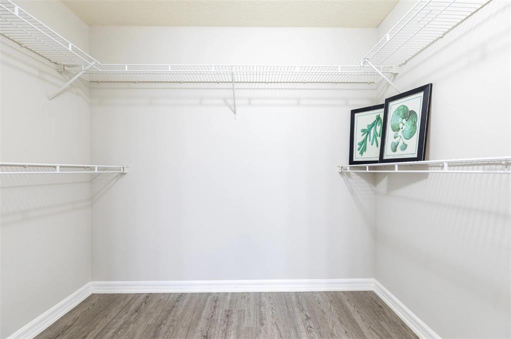 1010 Northwest Fresco Way, Unit 1B01206 Stuart, FL 34994 - Photo 16 of 47 a view of room with window and wooden floor