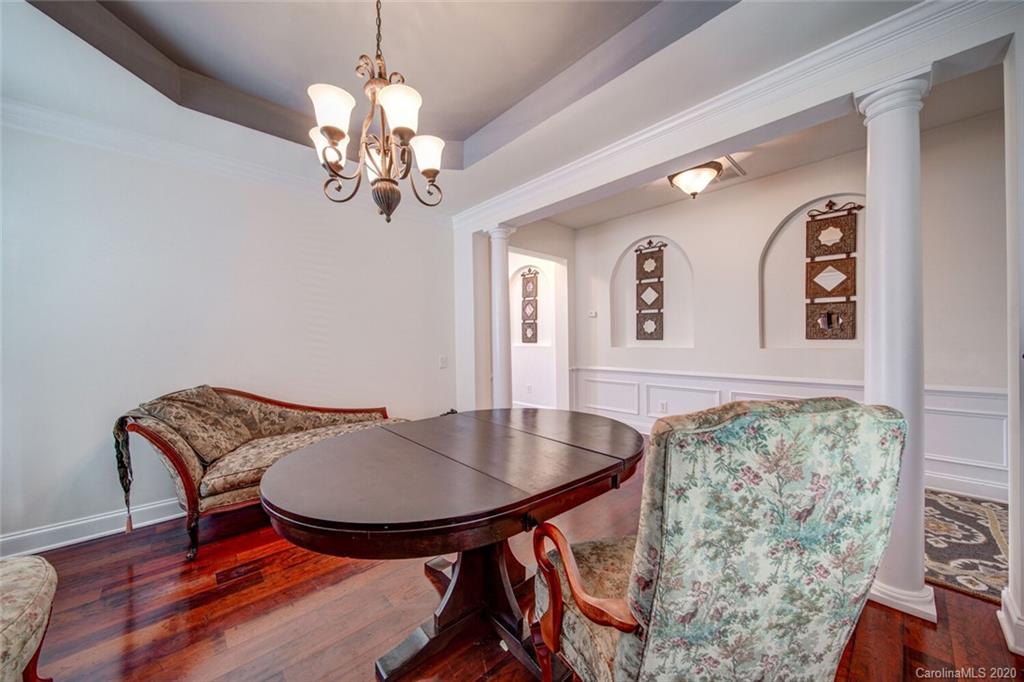 9510 Ridgeforest Drive Charlotte, NC 28277 - Photo 12 of 46 a view of a dining room with furniture and chandelier