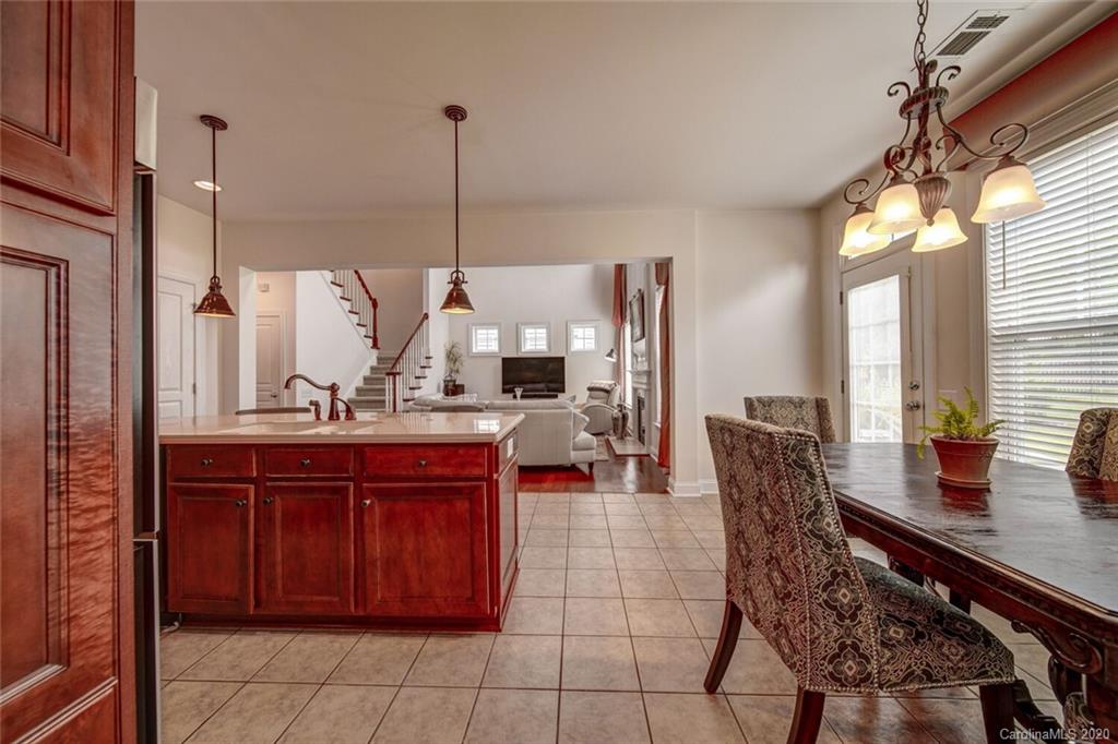 9510 Ridgeforest Drive Charlotte, NC 28277 - Photo 19 of 46 a view of dining table chairs and chandelier