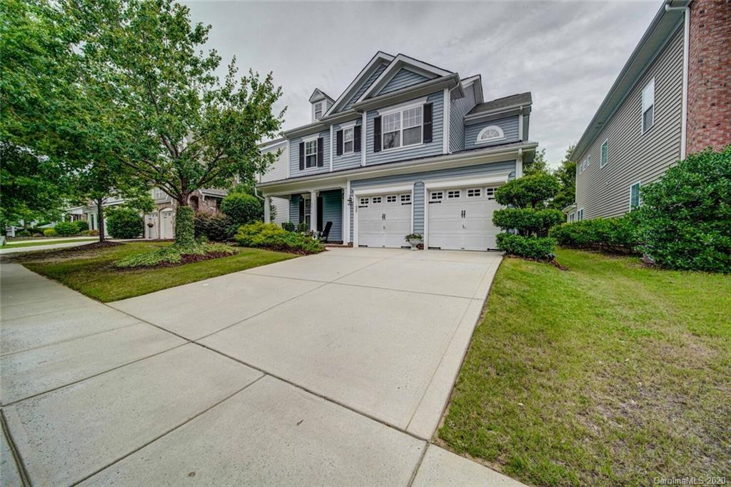 9510 Ridgeforest Drive Charlotte, NC 28277 - Photo 3 of 46 a front view of a house with a yard